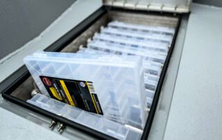 Stormcat front deck tackle storage with 9 Plano boxes